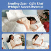 Sending Zzzs, Gifts That Whisper Sweet Dreams! A woman sleeps on and hugs the white CozyRest pillow in a bedroom decorated for Christmas with a tree and wrapped gifts